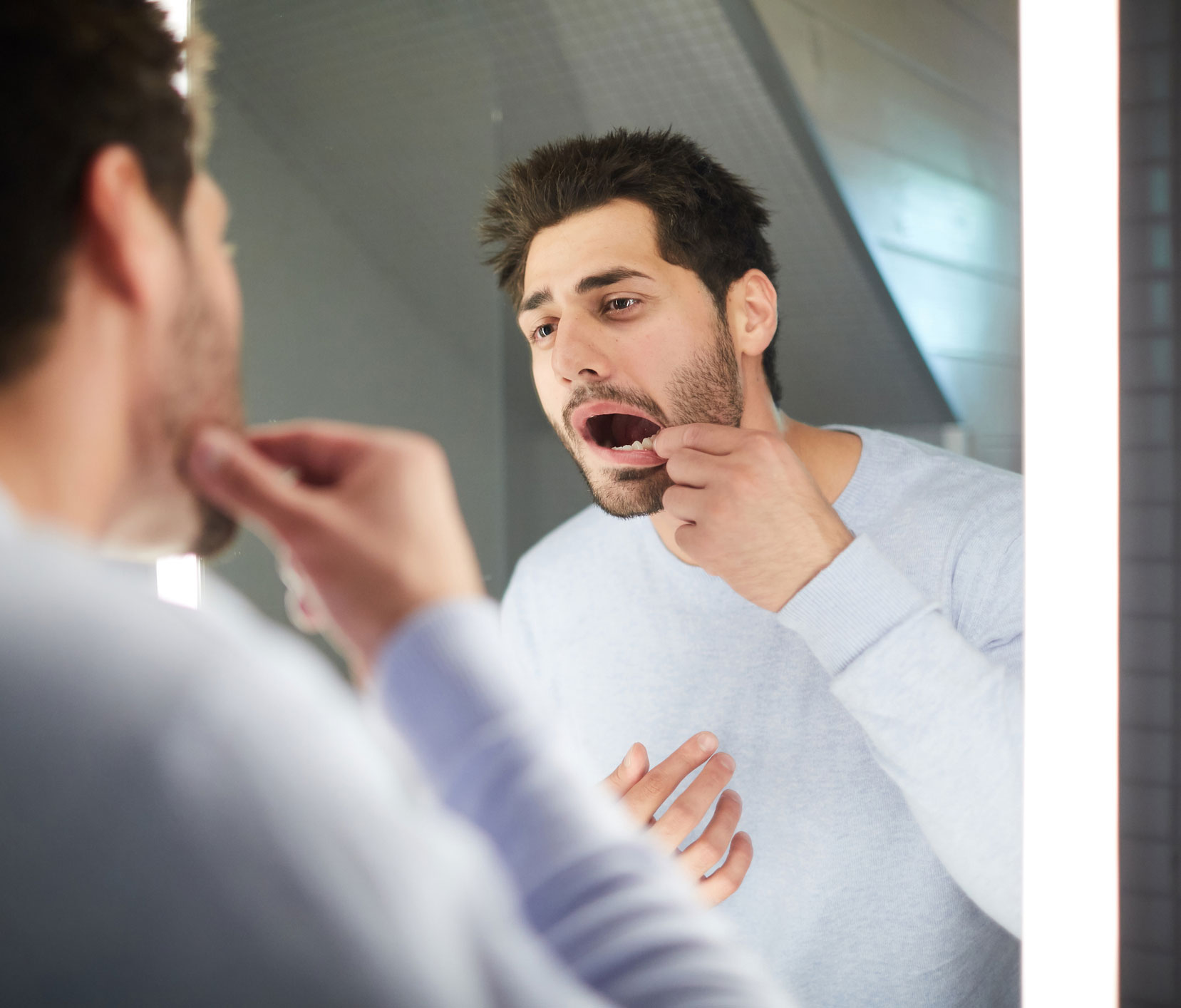 Man looking in mirror