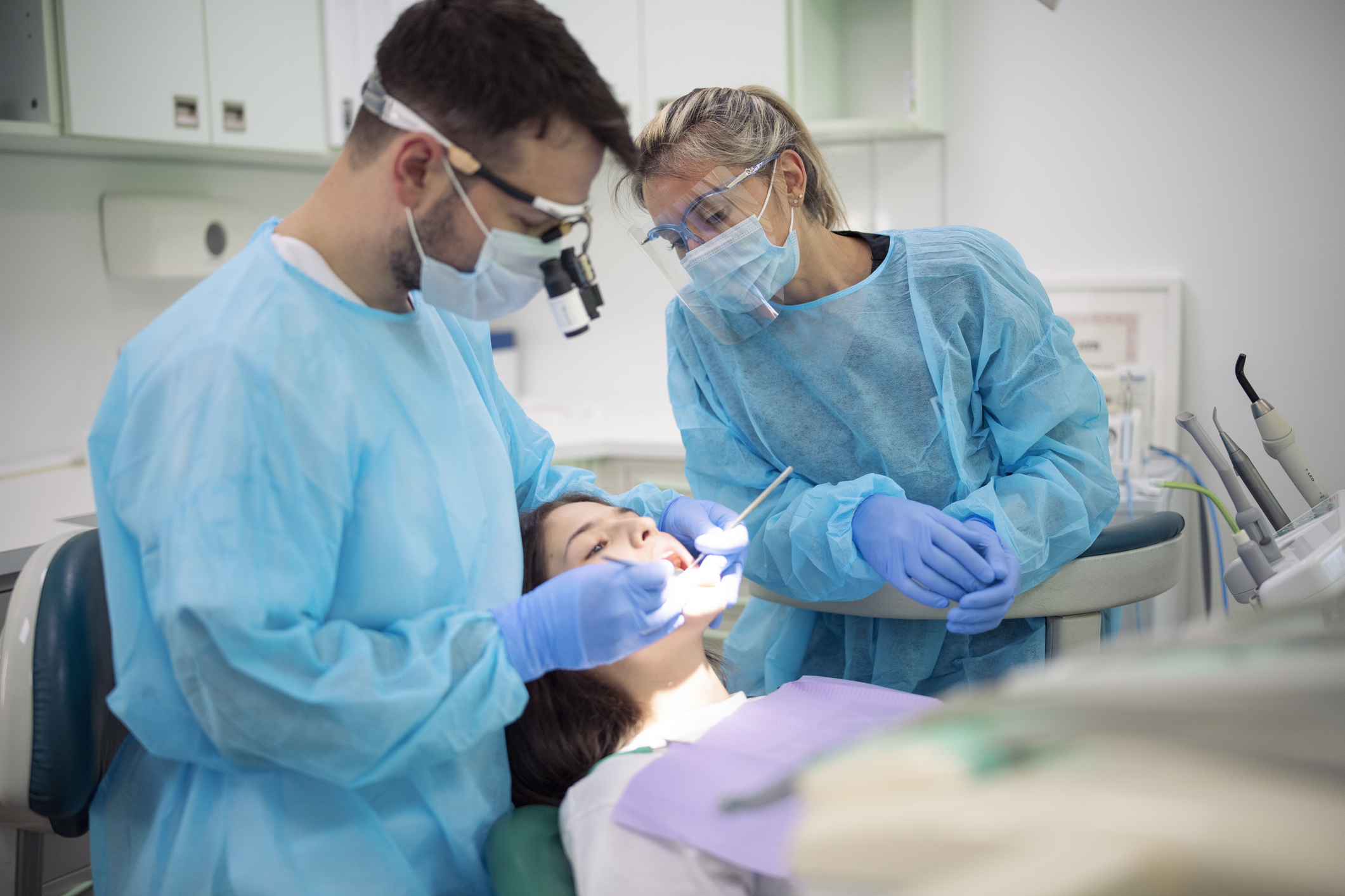 Dentist examining patient